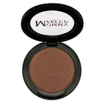 A single pan of pressed powder eyeshadow and blush with a bronze color shade, branded as 'Milk & Honey'.